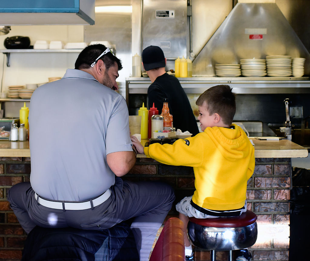 James 'Jay' Yeager eats breakfast with his son Maddox Yeager